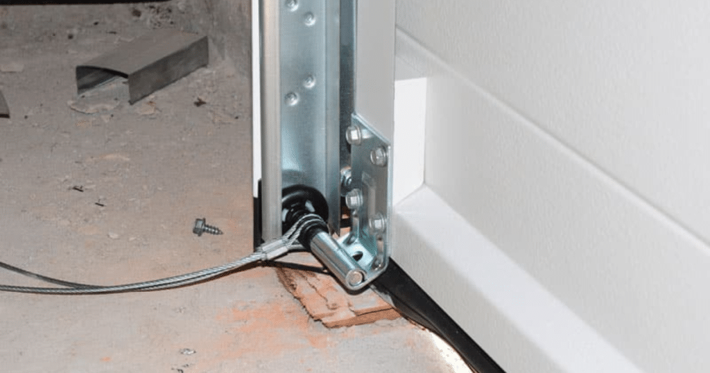 Garage door cable attached near bottom.